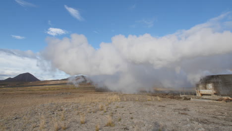 Water-vapour-coming-out-of-a-chimney-pipe,-from-a-geothermal-Power-Plant